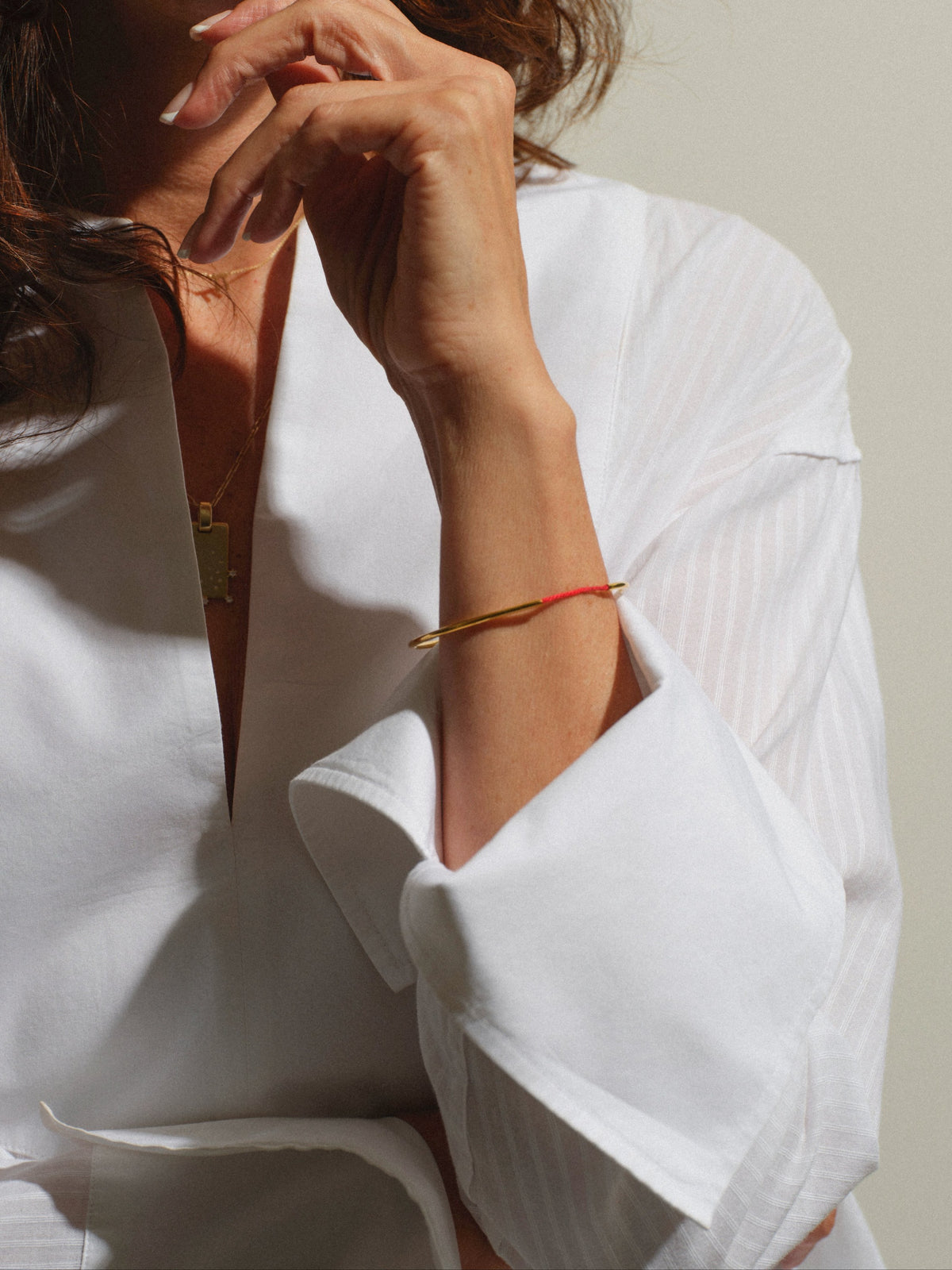 Tiferet Bangle worn — 18k gold-plated Kabbalah red thread bangle, everyday look — Oriya Jewels